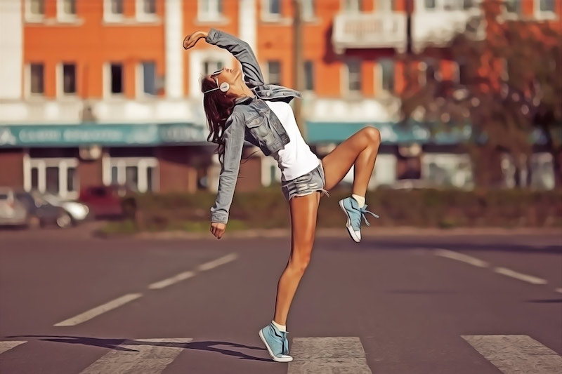 Beautiful dancing girl on street with painted Photoshop action