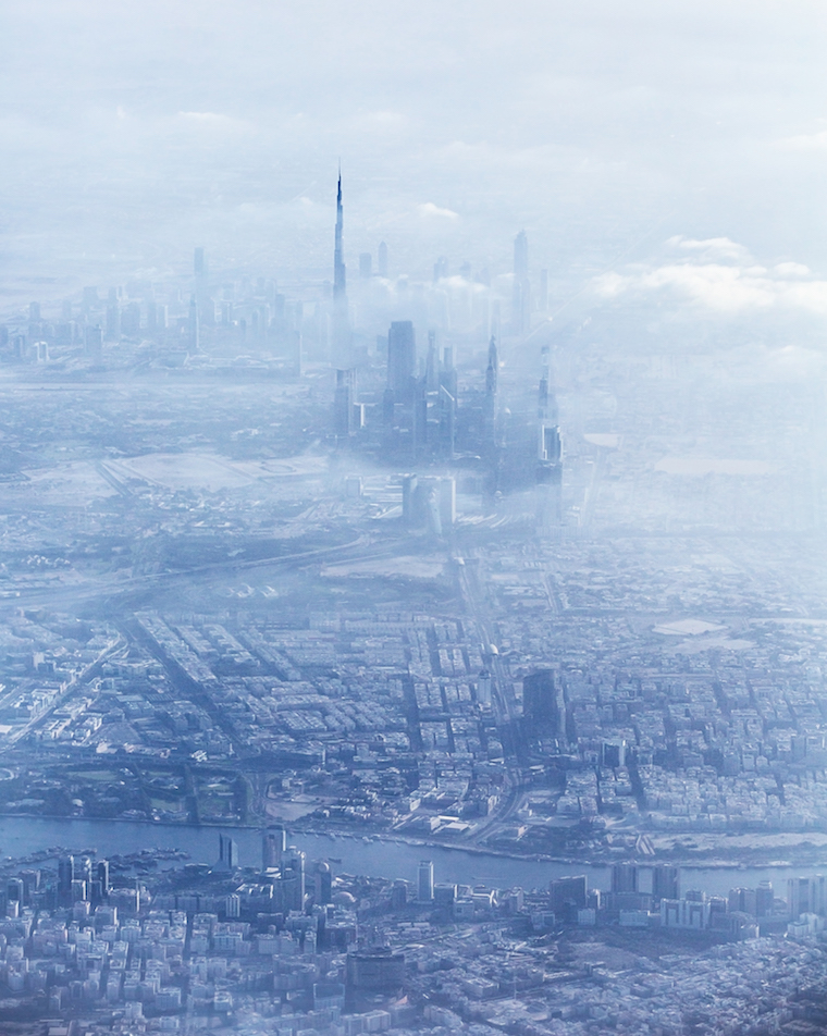 Beautiful aerial view on Dubai downtown covered with fog, bad weather on luxury resort, travel and vacation concept