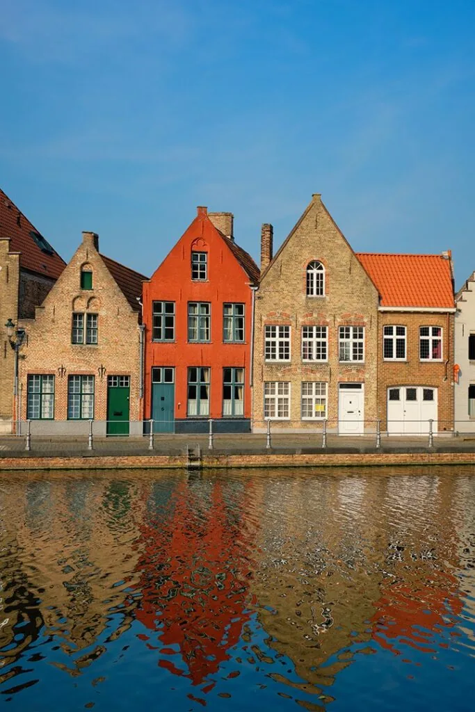 Typical Belgian cityscape Europe tourism concept - canal and old houses on sunset. Bruges (Brugge), Belgium