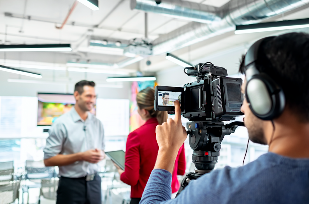 TV presenter talking to camera
