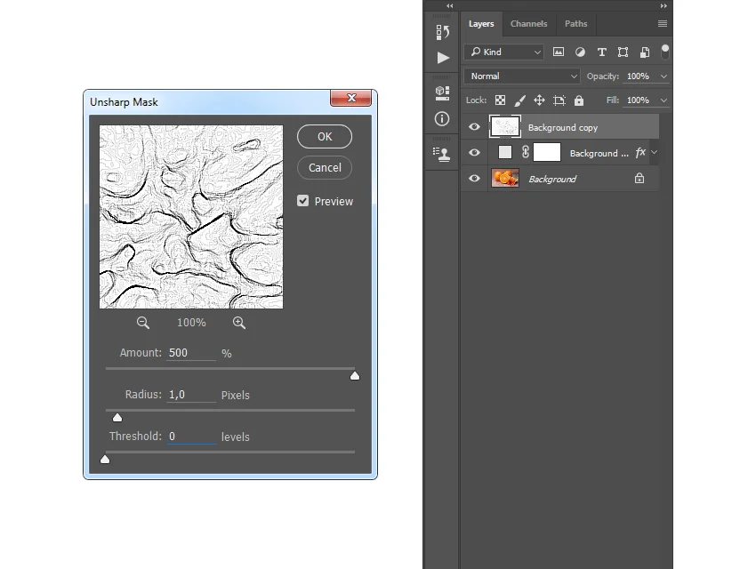 Press Control-I on your keyboard to invert this layer. Then, go to Filter > Sharpen > Unsharp Mask and set the Amount to 500%, Radius to 1 px, and Threshold to 0 levels