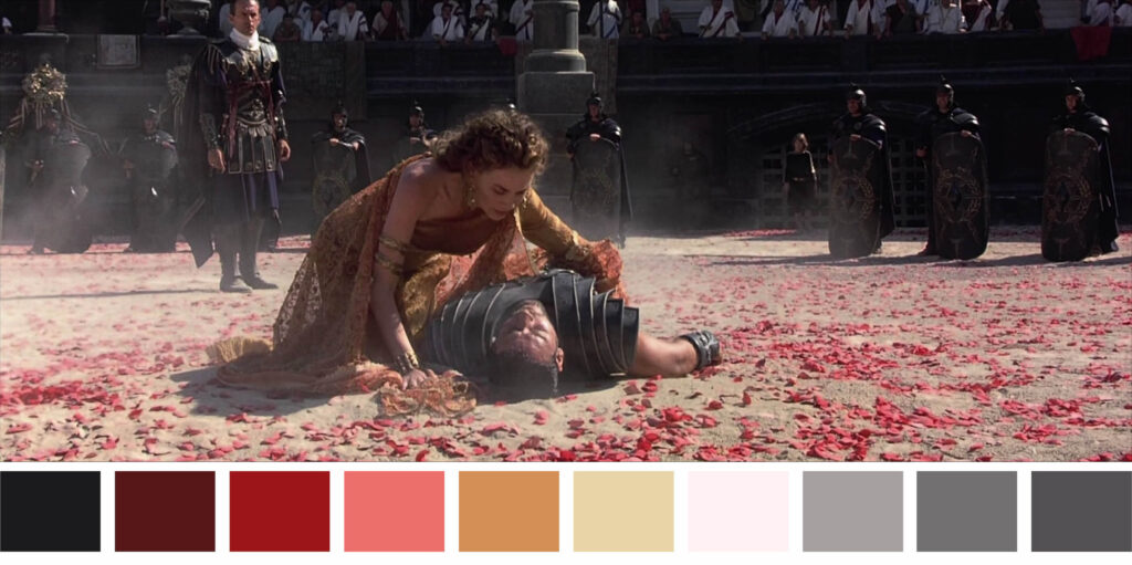 Image of a woman kneeling over the gladiator on the ground from Gladiator (2000).