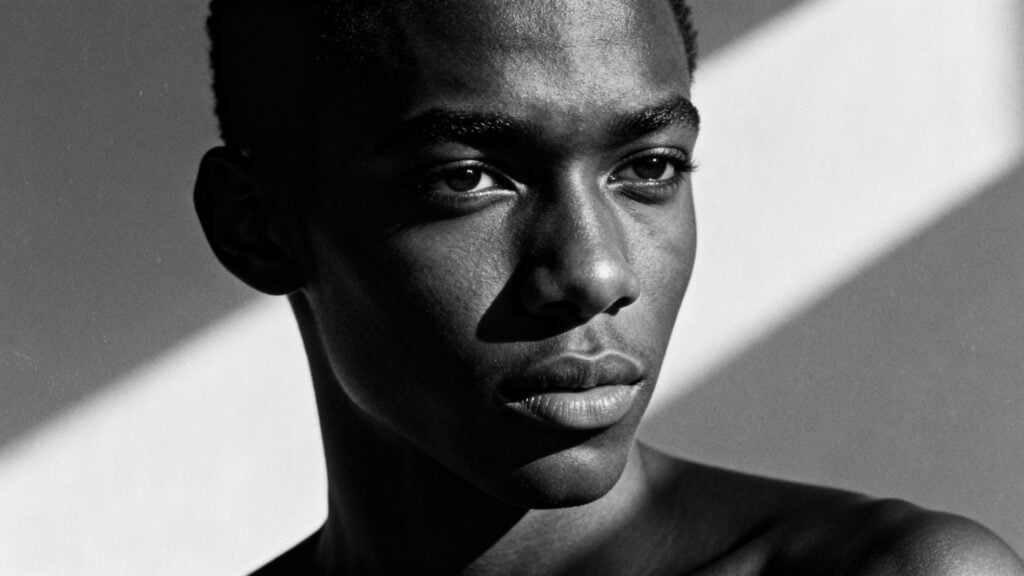 High-contrast monochrome portrait of a young black man generated with ImageGen styles