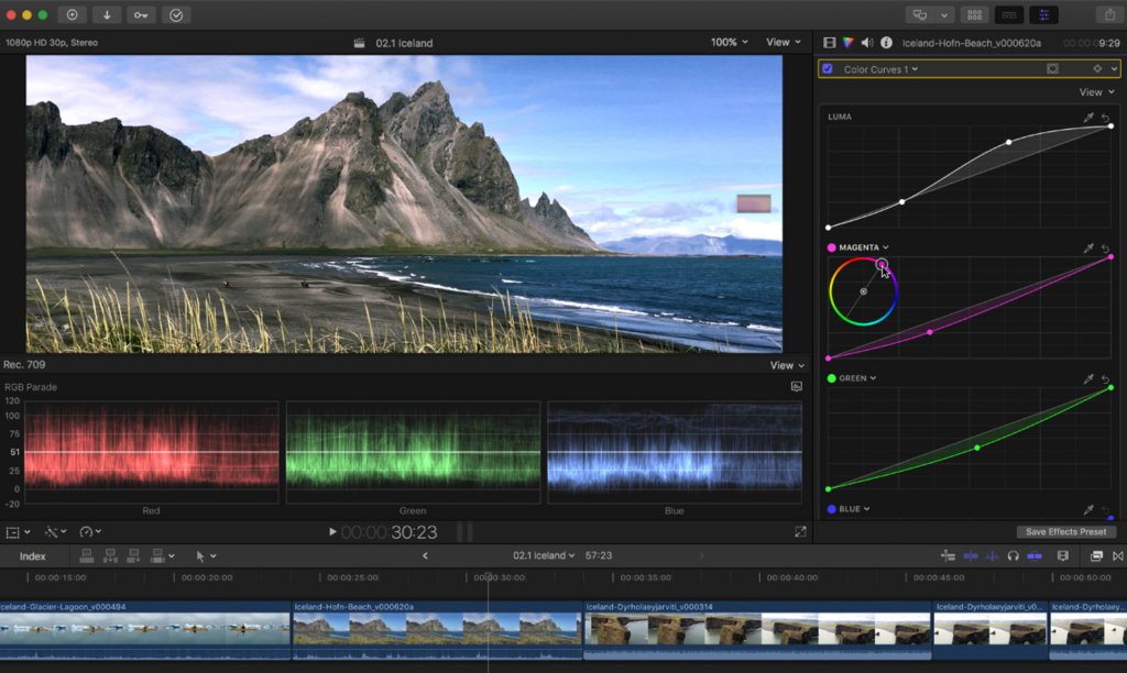 A screenshot of a video editing interface showing an Icelandic black sand beach and mountains, with color curves, RGB parade scopes, and a timeline visible.