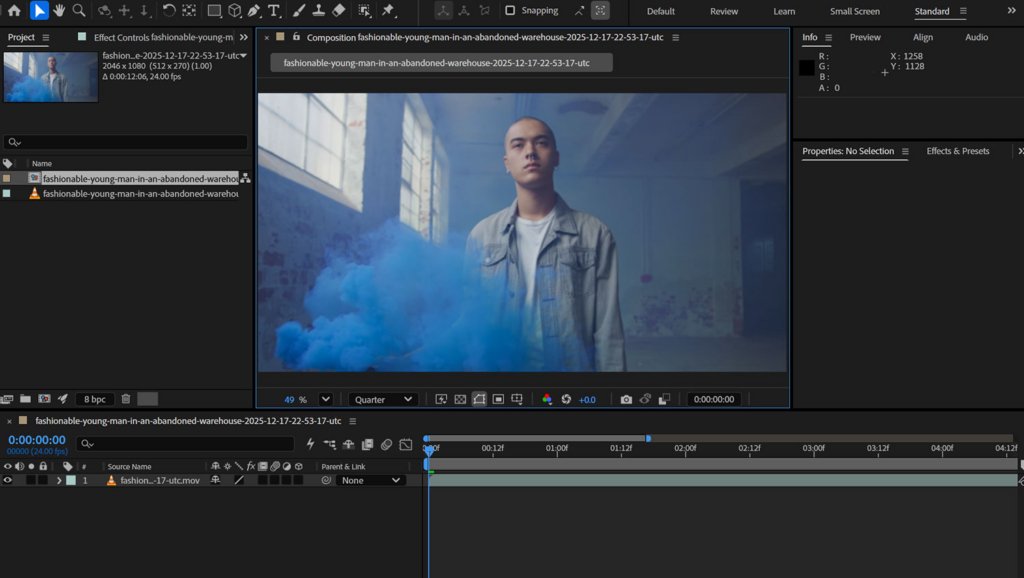 Screen capture of video editing software showing a young man in a denim jacket and blue smoke in an abandoned warehouse.