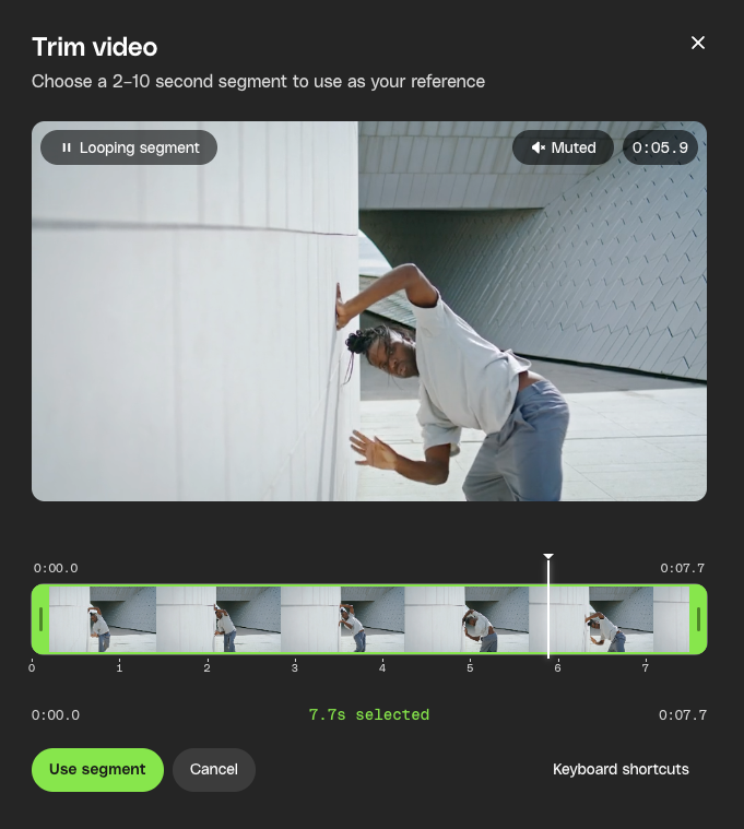 A video trimming interface showing a person leaning against a white wall, with a timeline, 'Use segment' button, and '7.7s selected' text.